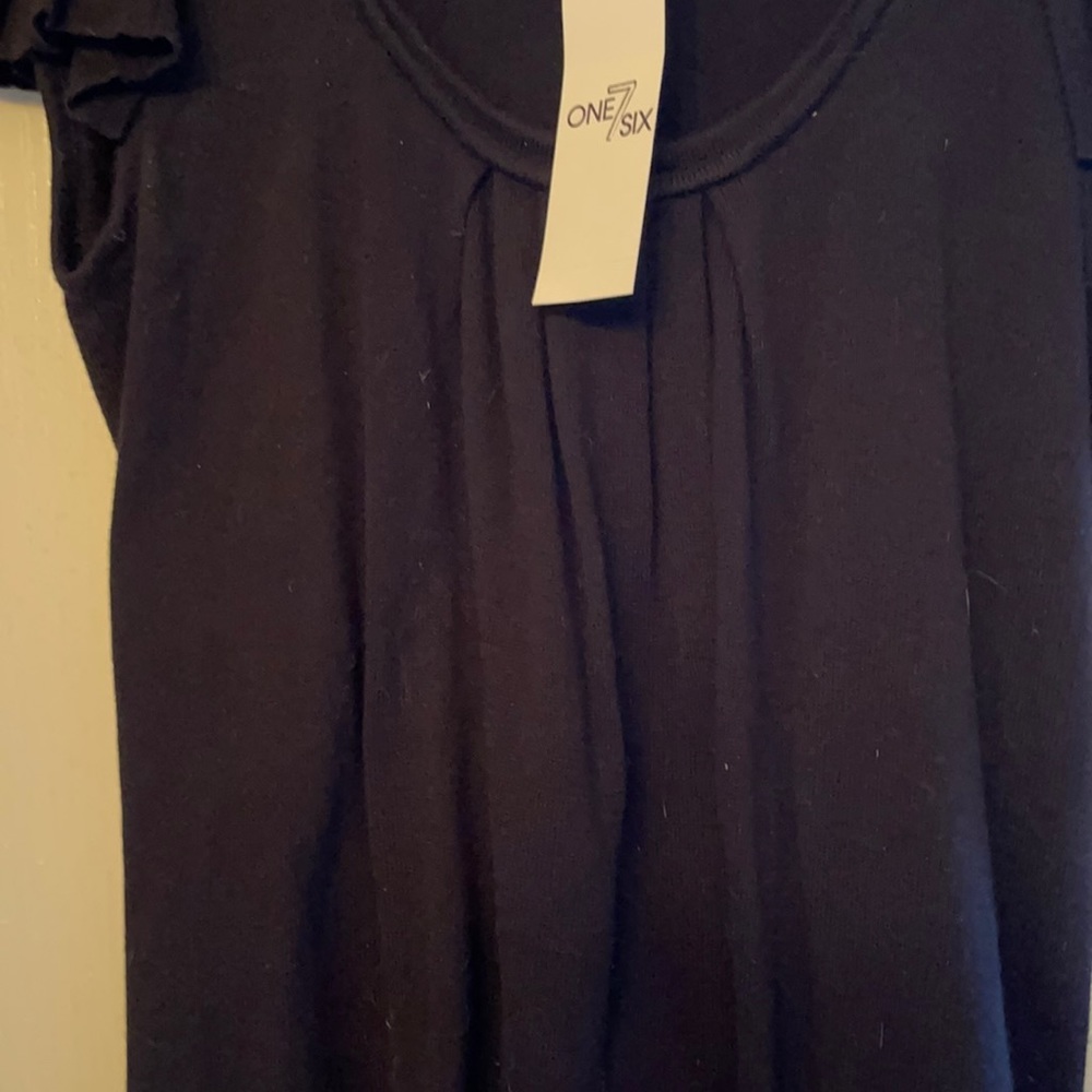 Scoop neck black top.